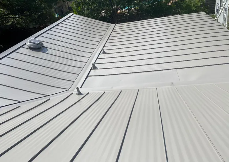 Solar attic fan installed on a metal roof for Roof Ventilation in Cheviot